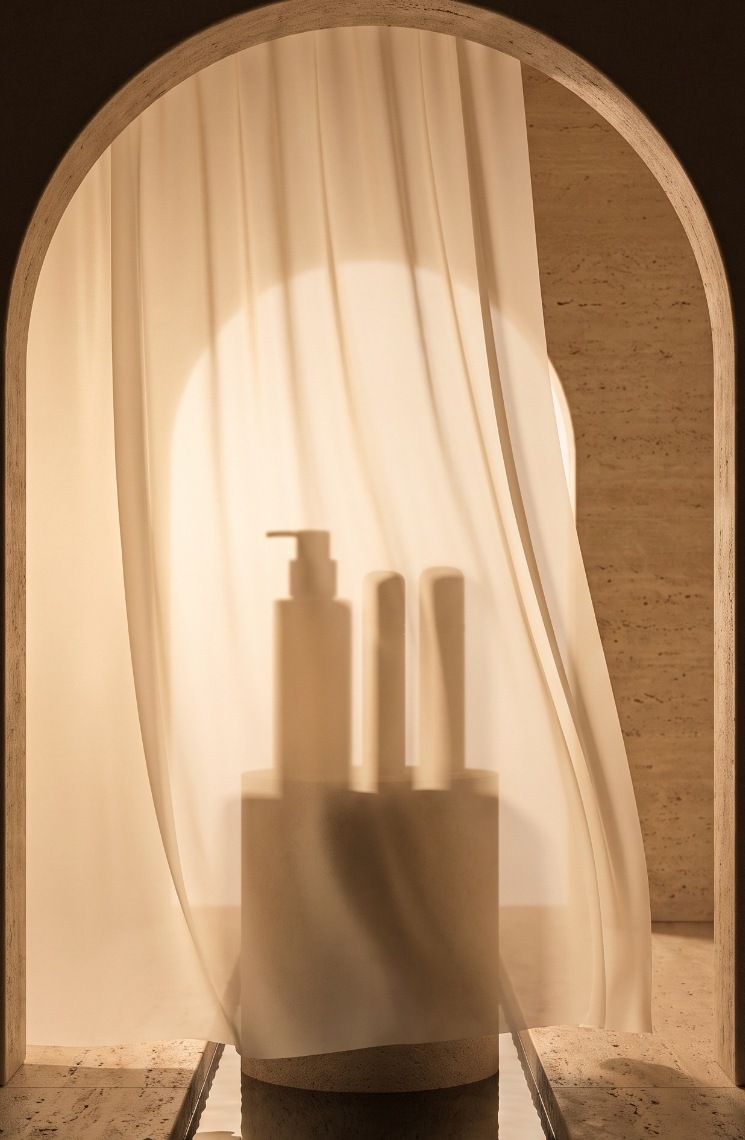 The AMINATIDE Foundational System veiled behind silk in a travertine arch